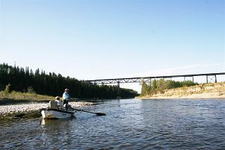Angling from a drift boat on the Red Deer River