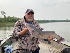 Long-time friend Brian Hagglund and a chunky catfish caught using a traditional stationary bait presentation.