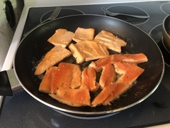 A frying pan full of tasty trout.
